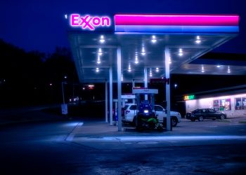 cars parked in front of UNKs store during night time