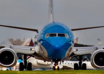 blue and white airplane on airport during daytime