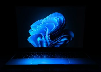 a macbook air laptop in the dark